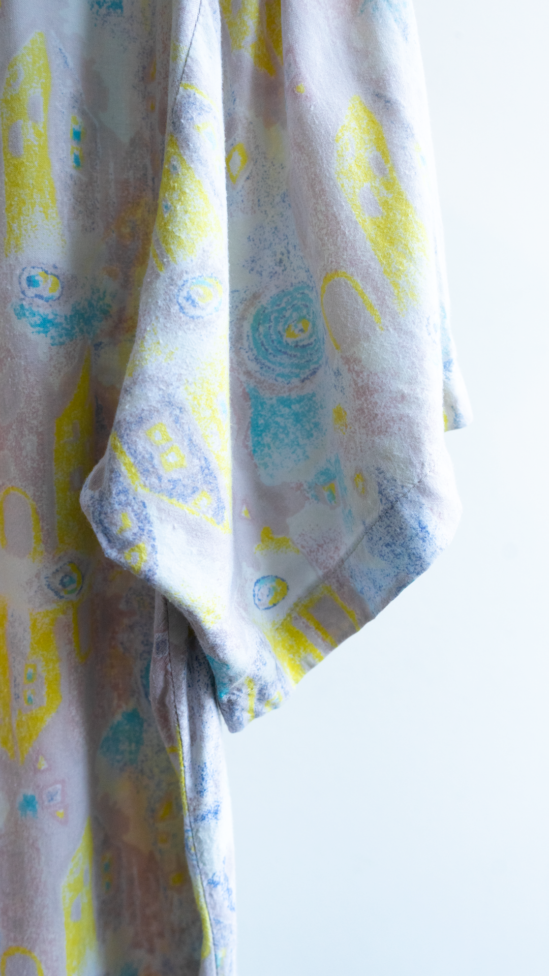 detail sleeve 80s spring shirt with abstract pattern yellow blue beige