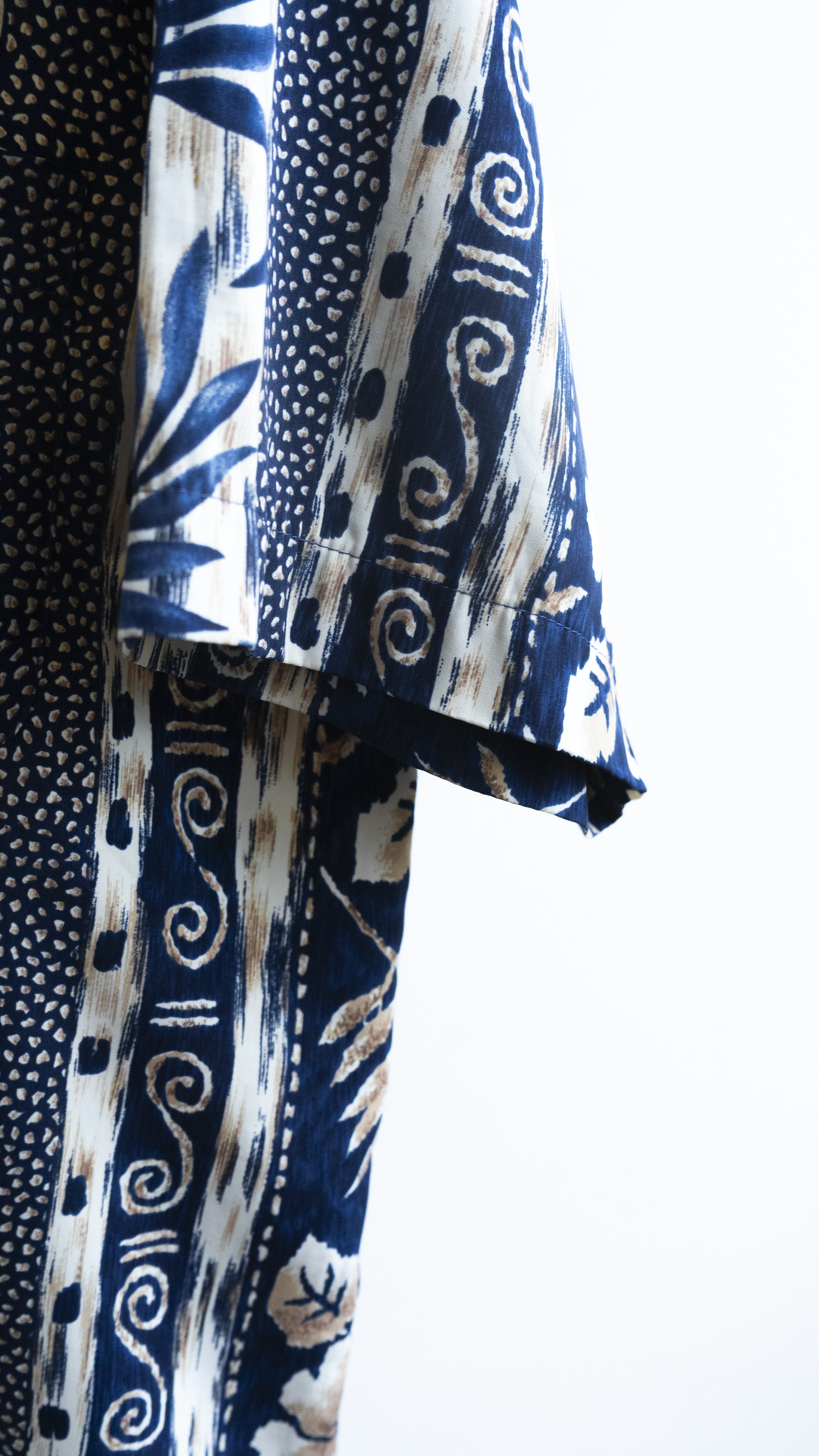 Detail of tropical print 90s hawaiian shirt in blue and white