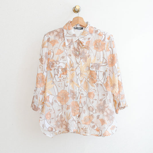 white vintage modissimo see-through vintage blouse with beige and orange flowers which is made in france