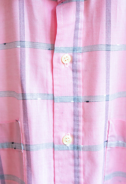 Close-up of soft pink checkered vintage shirt with with lines and buttons in LGBTQ- style fresh vintage