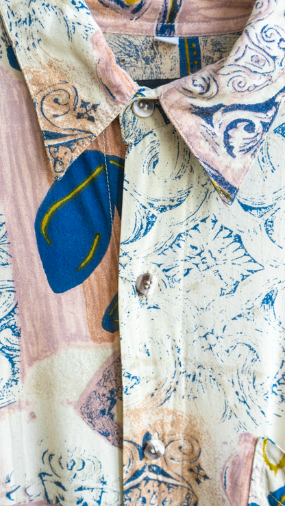 close up of a pink patterned vintage shirt with beige blue and hints of yellow by the Fresh Vintage brand