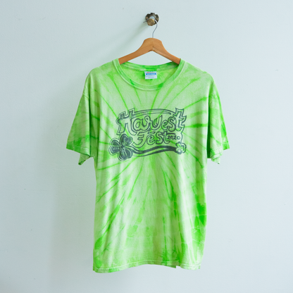 secondhand light green tie-dyed t-shirt with text 'harvest fest'