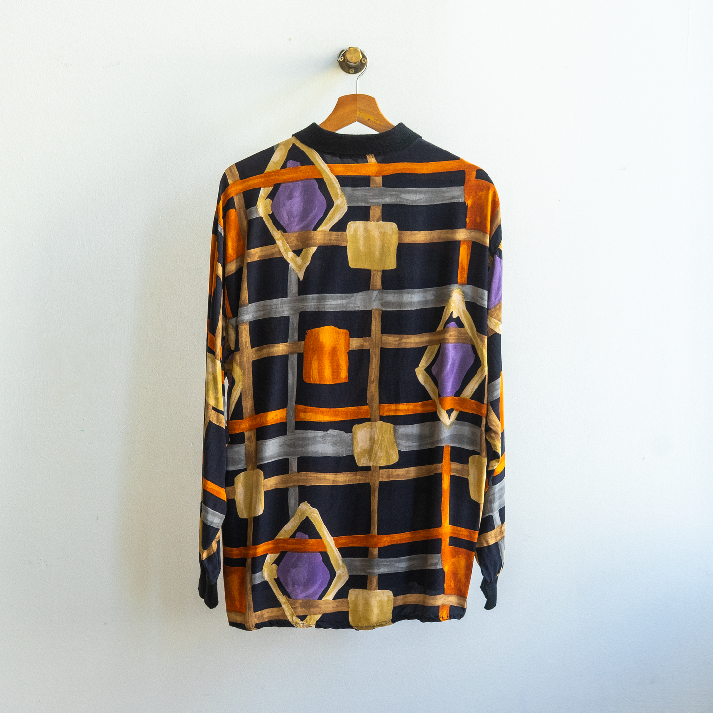 black vintage shirt with pattern in thick seemingly hand painted orange beige grey lines with randomly placed diamonds with brushed purple in them and some randomly placed squares forming beautiful aesthetic abstraction '90s shirt with long sleeves