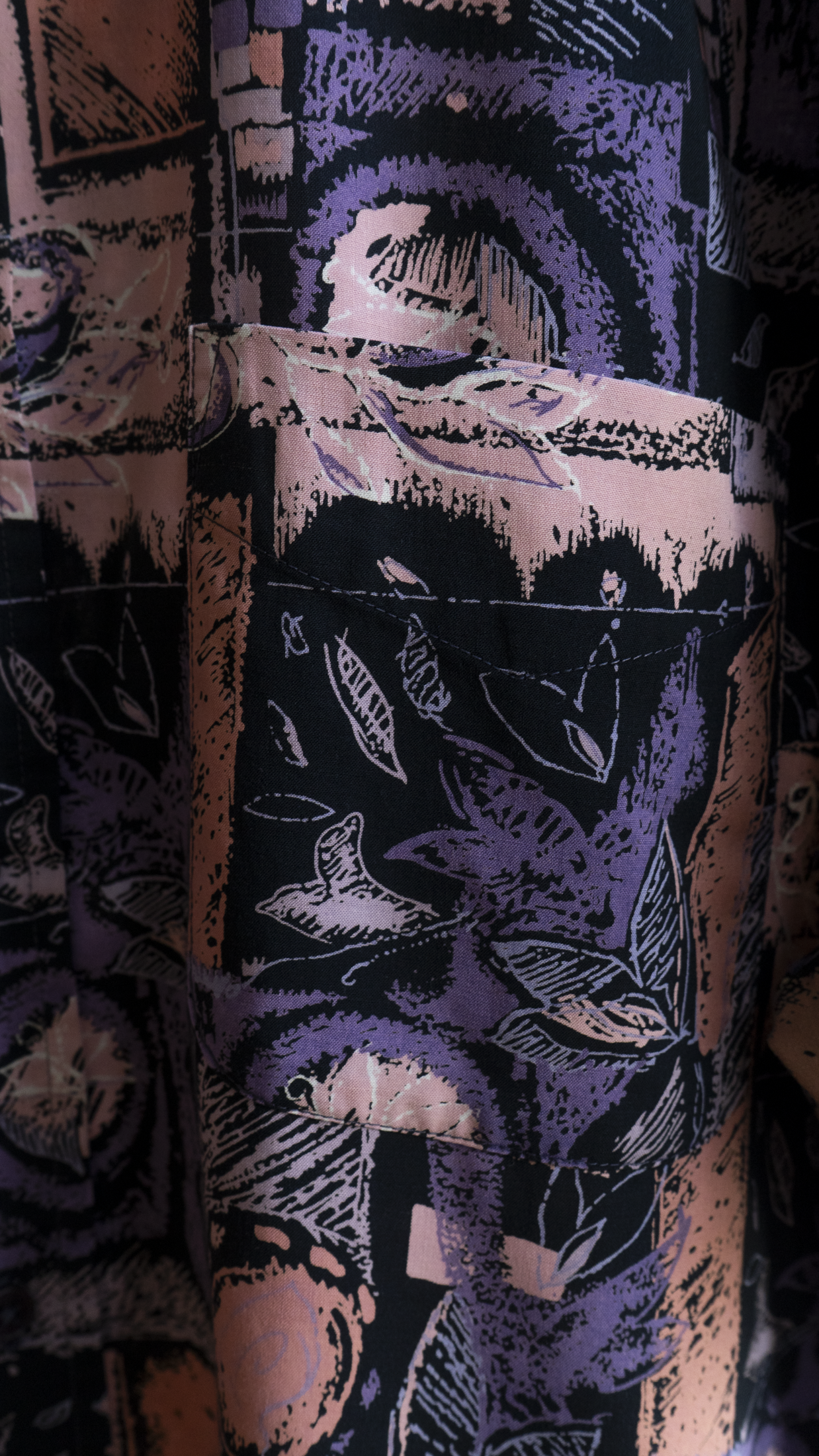 pocket of purple vintage shirt with abstract pattern in purple black and pink