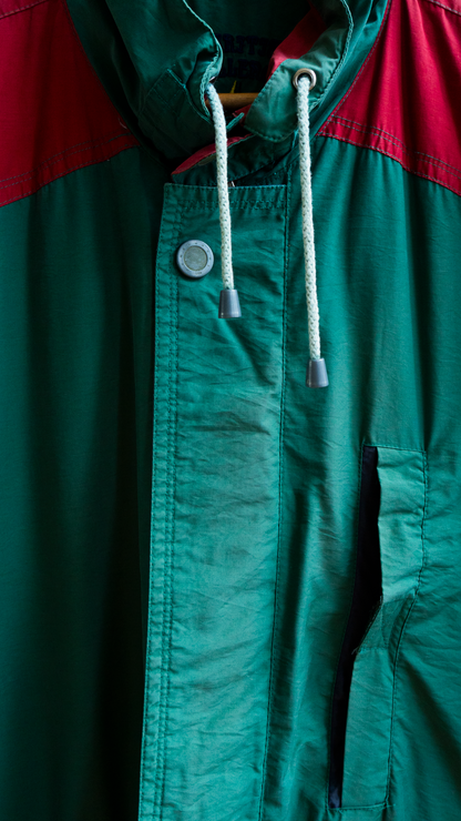 close-up of 80s raincoat green red drawstring and buttons