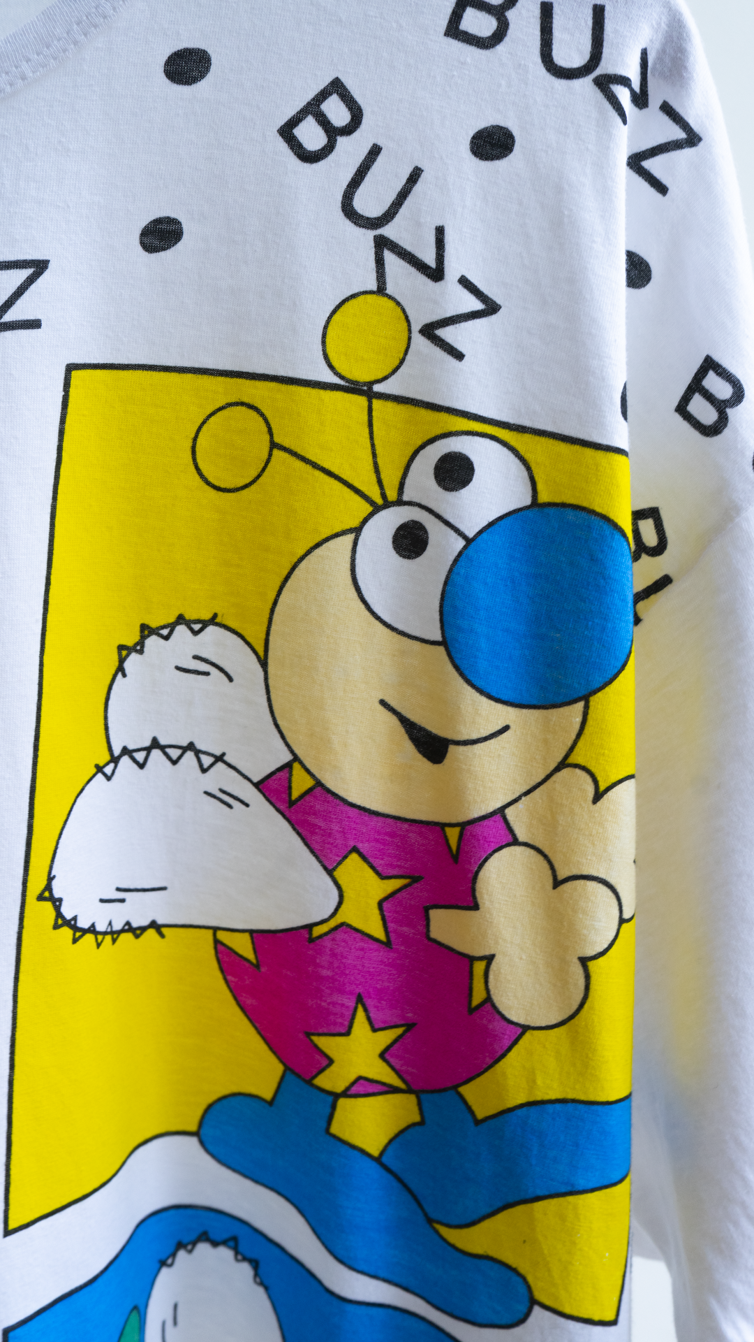 zoom of colorful bee graphic on white  oversized sleep t-shirt 1990s Y2K
