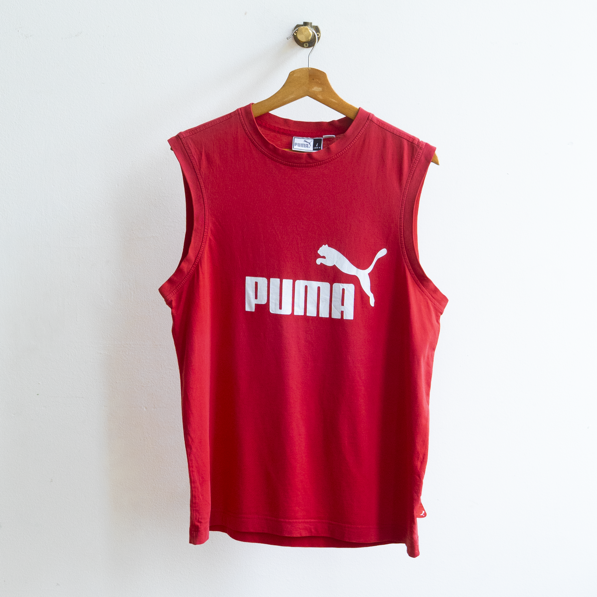 red secondhand sleeveless Puma top with dropped armholes
