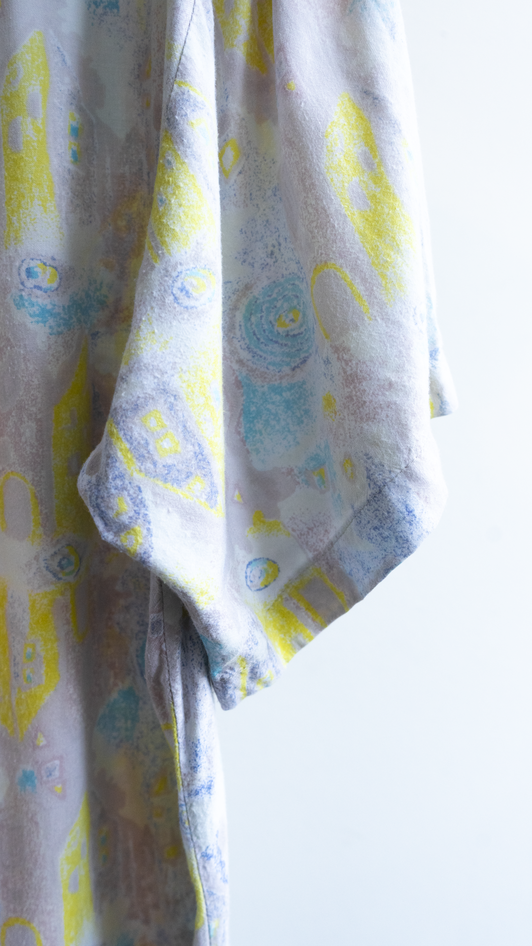 detail sleeve 80s spring shirt with abstract pattern yellow blue beige