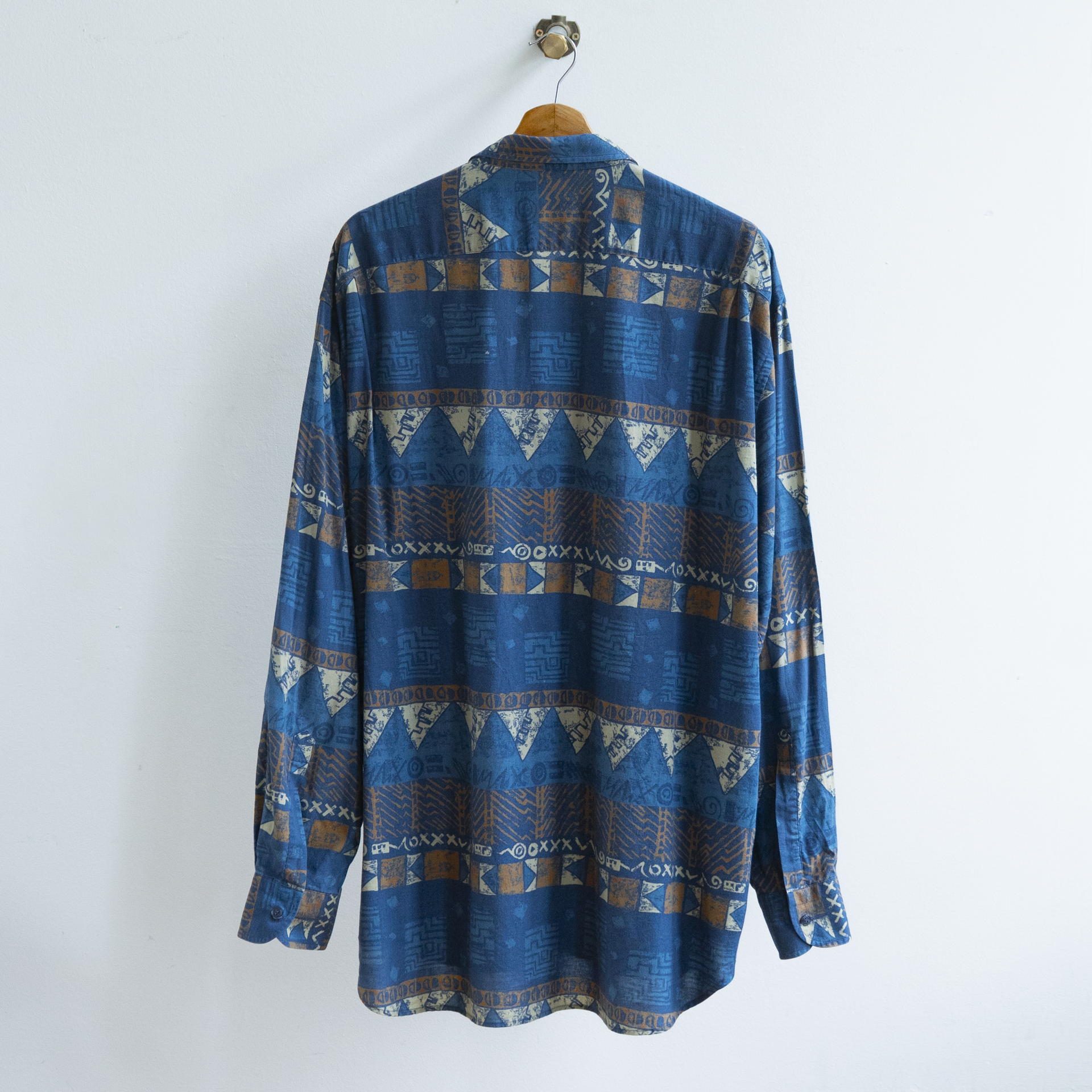 back of secondhand dark blue patterned shirt