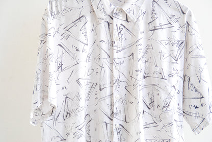 White vintage shirt with black abstract pattern and buttons detail