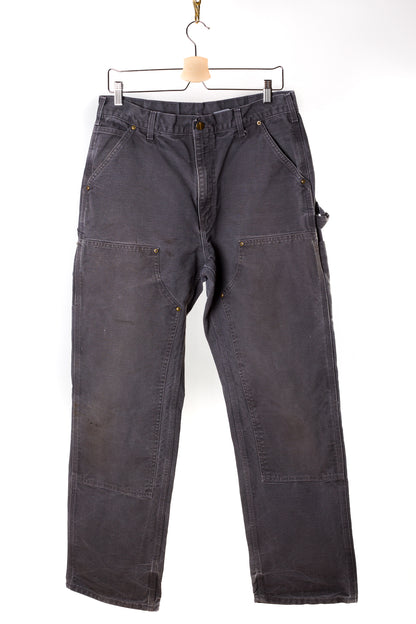 grijze-carhartt-jeans-met-gouden-knopen